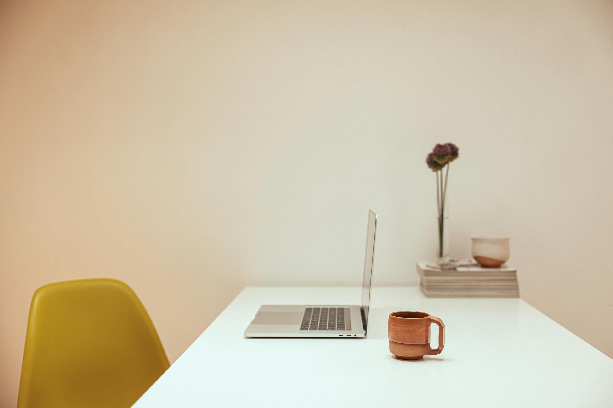Office yellow chair and laptop cup of couple 8473764